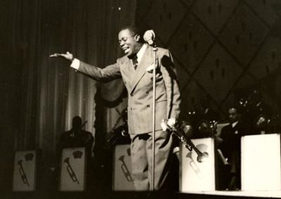 Taking bows on stage with his big band, late 1930s
